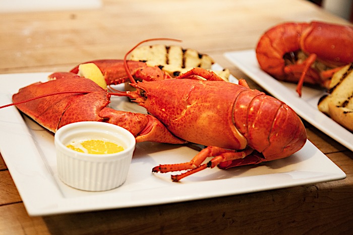 A whole cooked lobster on plate